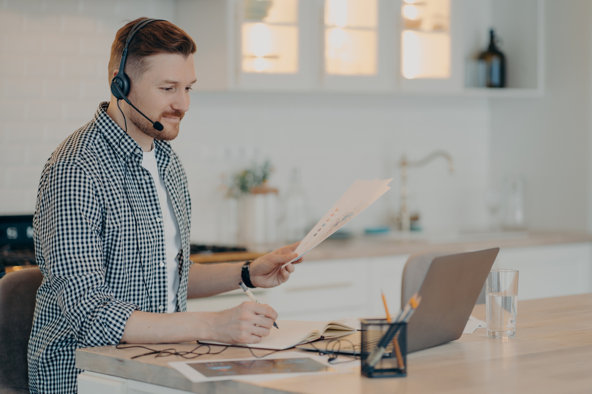 Smiling guy during online meeting while working at home